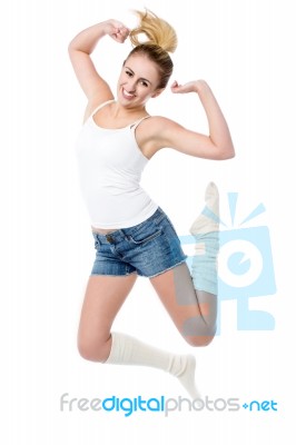 Attractive Girl Jumping With Joy Stock Photo