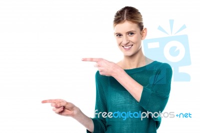 Attractive Girl Pointing Towards Copy Space Area Stock Photo