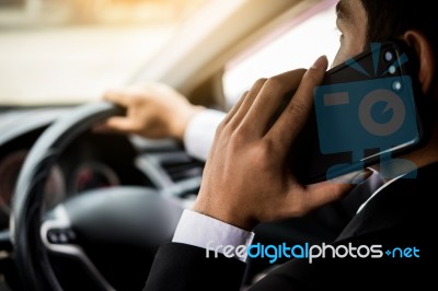 Attractive Handsome Young Businessman Using Mobile Smart Phone I… Stock Photo