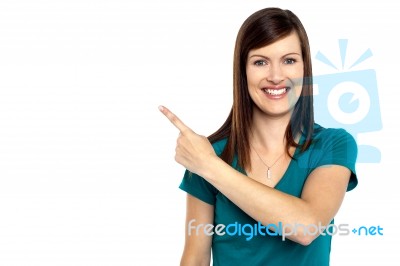 Attractive Lady Pointing Towards Copy Space Area Stock Photo