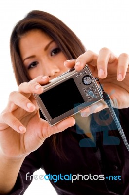 Attractive Woman Holding Camera Stock Photo