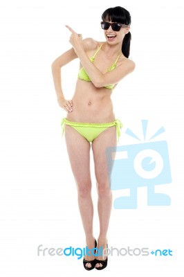 Attractive Woman In Green Bikini Being Expressive Stock Photo