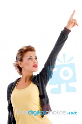 Attractive Woman Pointing Upward Stock Photo