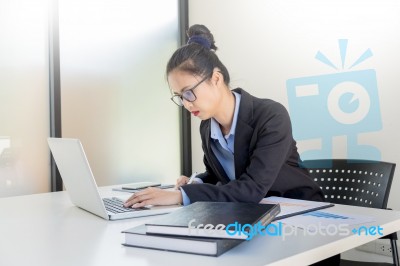 Attractive Women In Casual Business Sitting At A Table Working O… Stock Photo