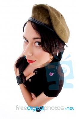 Attractive Young Female With Arms Crossed And Army Cap Stock Photo