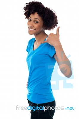 Attractive Young Model Gesturing A Mock Call Stock Photo