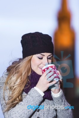 Attractive Young Stylish Blonde Girl Drinks Hot Drink From A Mug… Stock Photo