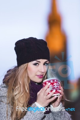 Attractive Young Stylish Blonde Girl Drinks Hot Drink From A Mug… Stock Photo