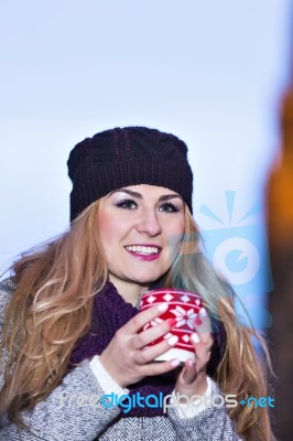 Attractive Young Stylish Blonde Girl Drinks Hot Drink From A Mug… Stock Photo