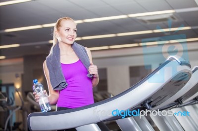 Attractive Young Woman After Running On A Treadmill, Exercise At… Stock Photo