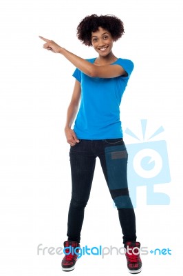 Attractive Young Woman Pointing Sideways Stock Photo