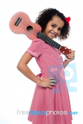 Atttactive School Girl With Toy Guitar Stock Photo