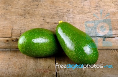 Avocado Fruit On The Wooden Background Stock Photo