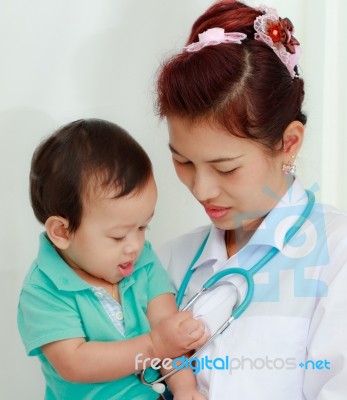 Baby And Female Doctor Stock Photo