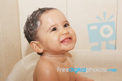 Baby Bathes In Bathroom Stock Photo