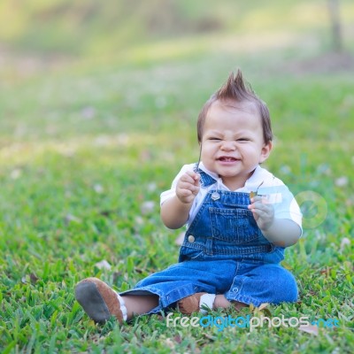 Baby Boy On Grass Stock Photo