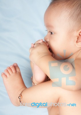 Baby Boy Playing With His Foot Stock Photo