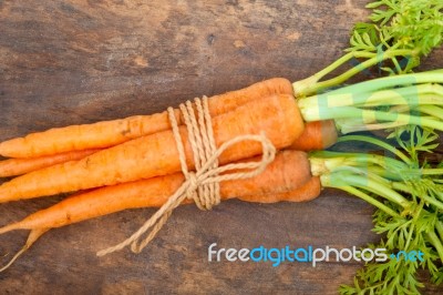 Baby Carrots Bunch Tied With Rope Stock Photo