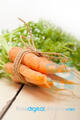 Baby Carrots Bunch Tied With Rope Stock Photo