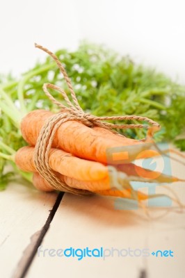 Baby Carrots Bunch Tied With Rope Stock Photo