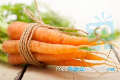 Baby Carrots Bunch Tied With Rope Stock Photo