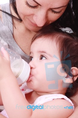 Baby Drinking Milk From Bottle Stock Photo