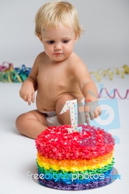 Baby Girl Celebrating Her First Bithday With Gourmet Cake And Ba… Stock Photo