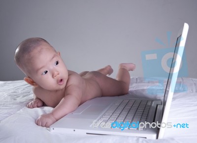 Baby Girl Interested In Computer Stock Photo