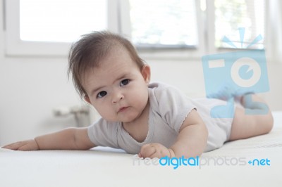 Baby Girl On Her Stomach Stock Photo