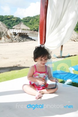 Baby Girl Sitting Stock Photo