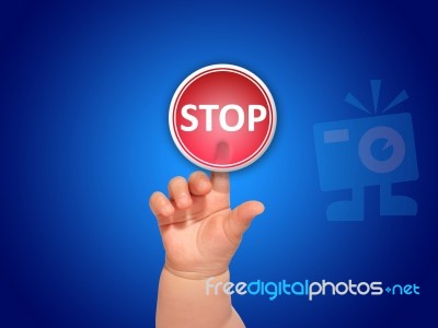 Baby Hand Pressing Button Stock Photo