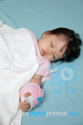 Baby Have Diarrhea And Sleep On A Bed In Hospital With Saline In… Stock Photo