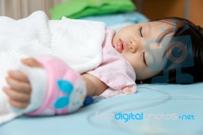 Baby Have Diarrhea And Sleep On A Bed In Hospital With Saline In… Stock Photo