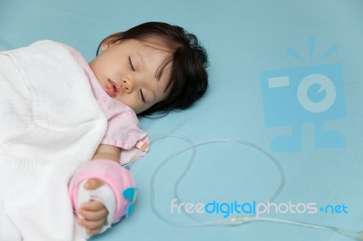 Baby Have Diarrhea And Sleep On A Bed In Hospital With Saline In… Stock Photo