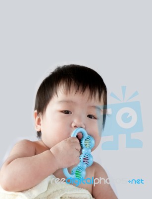 Baby Holding Toys Stock Photo