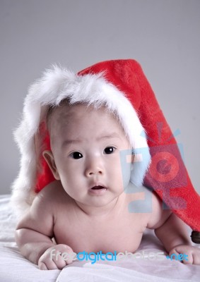 Baby In Christmas Hat Stock Photo