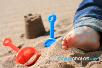 Baby On The Beach Stock Photo