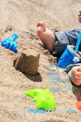 Baby On The Beach Stock Photo