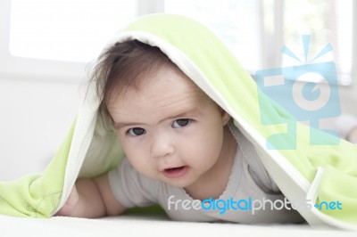 Baby Under Blanket Stock Photo