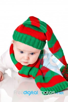 Baby With Christmas Hat And Scarf Stock Photo