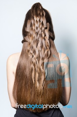 Back Portrait Of Beautiful Woman With Braiding Hair Stock Photo