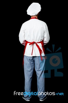 Back Pose Of A Male Chef In Uniform Stock Photo