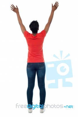 Back Pose Of A Woman With Raised Arms Stock Photo