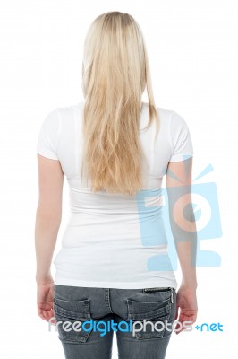 Back Pose Of A Young Woman In Casuals Stock Photo