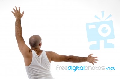 Back Pose Of Male Doing Exercise Stock Photo