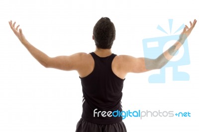 Back Pose Of Man With Raised Arms Stock Photo