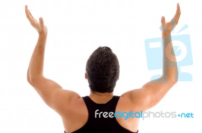 Back Pose Of Man With Raised Arms Stock Photo