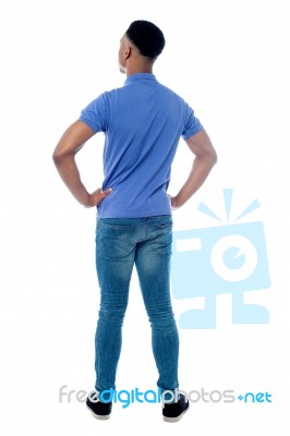 Back Pose Of Smart Young Guy Stock Photo