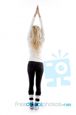 Back Pose Of Woman Exercising Stock Photo