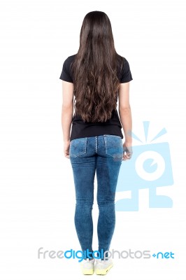 Back Pose Of Young Woman Stock Photo